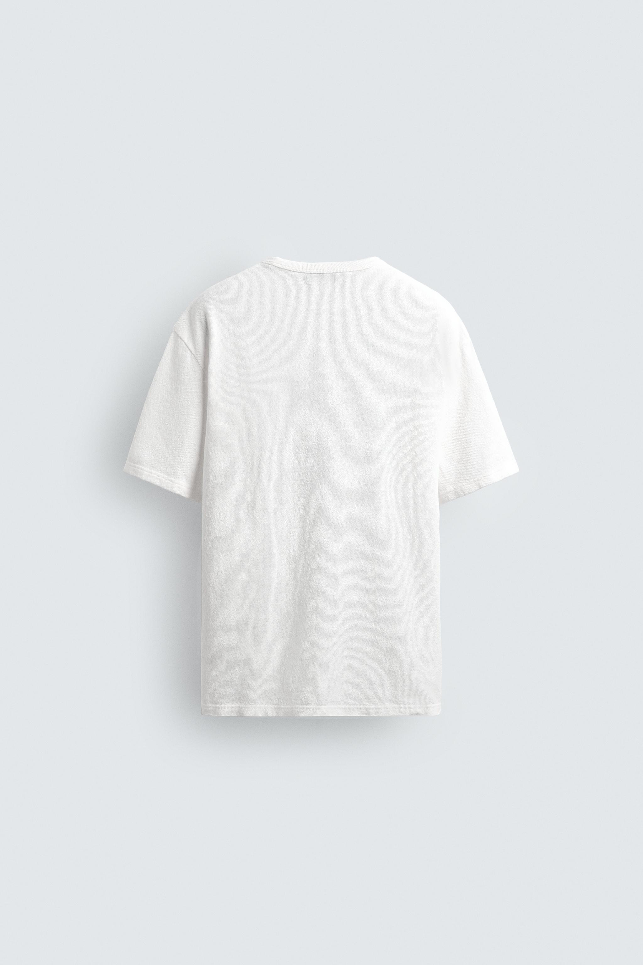 T-SHIRT EN MAILLE À IMPRIMÉS DÉLAVÉS